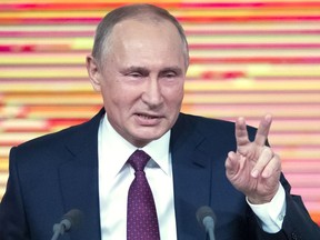 Russian President Vladimir Putin gestures during his annual news conference in Moscow, Russia, Thursday, Dec. 14, 2017.