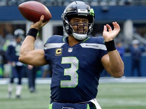 Seattle Seahawks quarterback Russell Wilson passes during warmups before an NFL football game against the Los Angeles Rams on Dec. 17, 2017