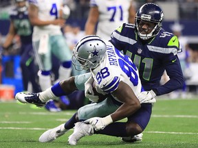 Dez Bryan of the Dallas Cowboys is tackled by Byron Maxwell of the Seattle Seahawks at AT&T Stadium on Dec. 24, 2017 in Arlington, Texas.  (Ronald Martinez/Getty Images)
