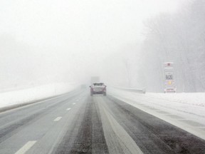 In this Wednesday, Dec. 27, 2017, photo, people drive on Interstate 90 near the Vrooman Road exit in Ohio. Severe cold and bone-chilling winds are gripping most of Ohio. Temperatures were climbing Thursday out of low single digits, although wind-chill readings remained around zero in some areas. Bitter cold, with light snowfall, is expected to return this weekend as a weather system sweeps the state. (Lynn Ischay/The Plain Dealer via AP)