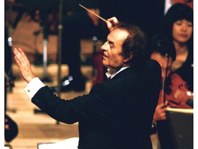 FILE - In this June 19, 2003 file photo, conductor Charles Dutoit performs with NHK Symphony Orchestra in Tokyo, Japan. Four women have accused Dutoit of sexual misconduct that allegedly occurred on the sidelines of rehearsals or performances with some of America's great orchestras. The 81-year-old is the artistic director and principal conductor at London's Royal Philharmonic Orchestra. (Kyodo News via AP)