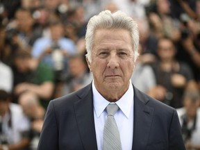 In this May 21, 2017 photo, actor Dustin Hoffman poses for photographers during the photo call for the film "The Meyerowitz Stories" at the 70th international film festival, Cannes, southern France. A second actress has come forward to accuse Hoffman of allegations of sexual harassment. Kathryn Rossetter, who co-starred with Hoffman in "Death of a Salesman" on Broadway, says the Oscar-winner would grope her nightly, demand foot rubs and once pulled her slip over her head to expose her breasts in front of the crew.