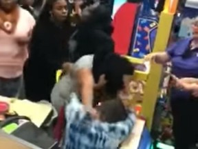 Two women were caught on video fighting at an Indianapolis, Ind. Chuck E. Cheese's this past Saturday. (YouTube/Cujo bailey)