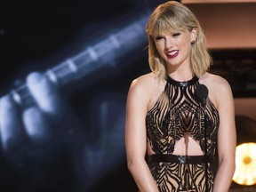 In this Nov. 2, 2016 file photo, Taylor Swift presents the award for entertainer of the year at the 50th annual CMA Awards in Nashville, Tenn. Swift’s “reputation” is finally available on Spotify, Apple Music and other streaming platforms. Swift released her sixth album three weeks ago, but did not put the album on streaming sites. The album sold more than 1 million copies in its first week.(Charles Sykes/Invision/AP, File)