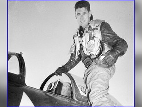 In this 1953 file photo, Capt. Ted Williams, former Boston Red Sox slugger, poses atop an airplane at a Marine air base in Korea after he crash landed his thunder jet at an advance airbase Feb. 15, 1953, on his first combat mission over North Korea against enemy targets. (AP Photo/Fred Waters)