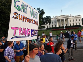 This file photo taken on July 26, 2017 shows protesters gathering in front of the White House in Washington, DC.
