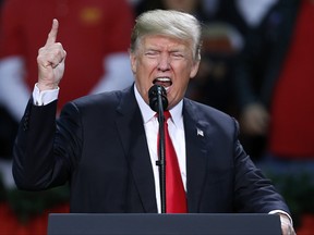 U.S. President Donald Trump speaks during a rally in Pensacola, Fla., Friday, Dec. 8, 2017.