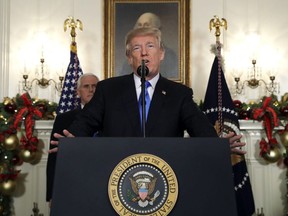 President Donald Trump speaks in the Diplomatic Reception Room of the White House, Wednesday, Dec. 6, 2017, in Washington.