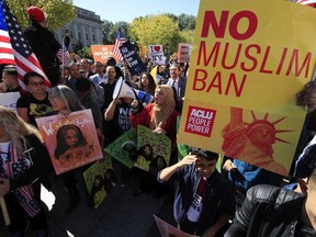 In this Oct. 18, 2017, file photo, protesters gather at a rally in Washington.