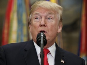 In this Dec. 12, 2017, photo, President Donald Trump speaks in the Roosevelt Room of the White House in Washington.