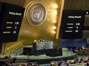 The results of a vote are posted in the General Assembly, Thursday, Dec. 21, 2017, at United Nations headquarters.
 (Manuel Elias/United Nations via AP)