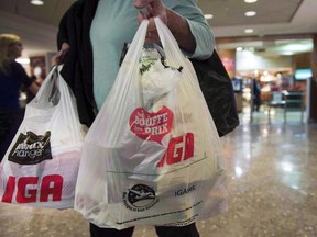 A woman leaves a grocery store Friday, May 15, 2015 in Montreal.