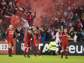 Toronto FC players celebrate their second goal against Seattle on Saturday. (ERNEST DOROSZUK/Toronto Sun)