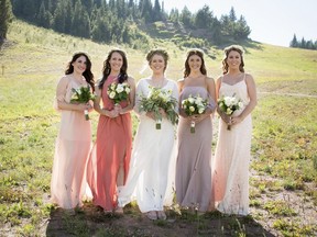 In this Sept. 2, 2017 photo provided by Nisha Louise, Alison Reed, center, of Colorado Springs, Colo., stands with her bridal party in Vail, Colo. Reed chose to allow her bridesemaids leeway in the colors and styles of dresses they wore. Experts say mismatched bridesmaids dresses are a growing trend as more brides personalize their weddings. (Nisha Louise Photography via AP) ORG XMIT: NYLS412

AP PROVIDES ACCESS TO THIS THIRD PARTY PHOTO SOLELY TO ILLUSTRATE NEWS REPORTING OR COMMENTARY ON FACTS DEPICTED IN IMAGE; MUST BE USED WITHIN 14 DAYS FROM TRANSMISSION; NO ARCHIVING; NO LICENSING; MANDATORY CREDIT