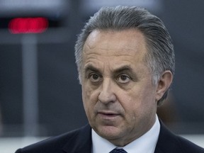 In this file photo taken on Thursday, Dec. 7, 2017, Vitaly Mutko, Russian Federation deputy prime minister and Russia 2018 WCup Local Organising Committee chairman, speaks with press during the opening of the WCup Fan ID distribution centre in Moscow, Russia. (AP Photo/Pavel Golovkin)