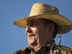 In this May 1, 2017 file photo, Cuban President Raul Castro watches the Mayday march at Revolution Square in Havana, Cuba.
