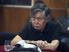 In this Oct. 25, 2013 file photo, Peru's jailed, former president Alberto Fujimori attends his hearing at a police base on the outskirts of Lima, Peru. (AP Photo/Martin Mejia, File)