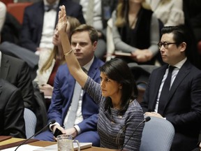 U.S. Ambassador Nikki Haley votes in favor of a resolution, Friday, Dec. 22, 2017, at United Nations headquarters. The Security Council is voting on proposed new sanctions against North Korea, including sharply lower limits on its refined oil imports, the return home of all North Koreans working overseas within 12 months, and a crackdown on the country's shipping.