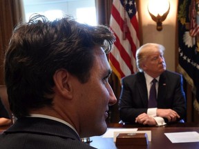 Prime Minister Justin Trudeau and U.S. President Donald Trump take part in a business roundtable discussion at the White House in Washington, D.C. on Monday, Feb. 13, 2017.