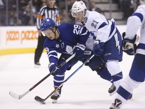 Tampa Bay Lightning centre Brayden Point ties up Toronto Maple Leafs winger William Nylander on Jan. 2, 2018