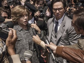 This image released by Sony - TriStar Pictures shows Michelle Williams, left, and Mark Wahlberg in a scene from "All the Money in the World." Williams was nominated for a Golden Globe for best actress in a motion picture drama for her role in the film. The 75th Golden Globe Awards will be held on Sunday, Jan. 7, 2018 on NBC. (Fabio Lovino/Sony-TriStar Pictures via AP)