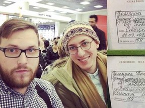 Pavel Stotzko and Yevgeny Voitsekhovsky are pictured next to their passports after getting married in Denmark.