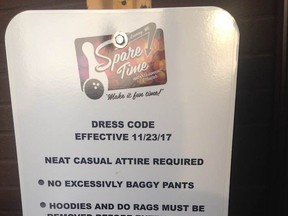 A sign at Spare Time Entertainment Center in Lansing, Mich. outlines the bowling alley's dress code policy.