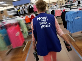 Barbara Kokensparger, who has been working with Wal-Mart for the past 11 years, walks to the children's clothing area to scan items at the new 2,000 square foot Wal-Mart Supercenter store May 17, 2006 in Bowling Green, Ohio. (Getty)