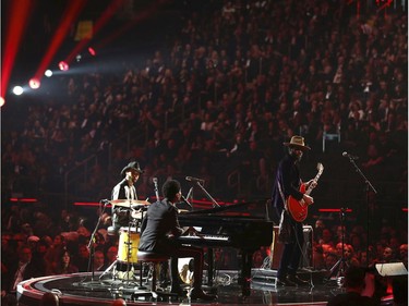 Joe Saylor, from left, Jon Batiste and Gary Clark Jr. perform a tribute to Chuck Berry and Fats Domino at the 60th annual Grammy Awards at Madison Square Garden on Sunday, Jan. 28, 2018, in New York. (Matt Sayles/Invision/AP)