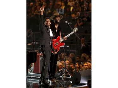 Jon Batiste, left, and Gary Clark Jr. perform a tribute to Chuck Berry and Fats Domino at the 60th annual Grammy Awards at Madison Square Garden on Sunday, Jan. 28, 2018, in New York.  (Matt Sayles/Invision/AP)