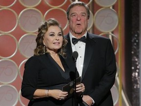 This image released by NBC shows presenters Roseanne Barr, left, and John Goodman at the 75th Annual Golden Globe Awards in Beverly Hills, Calif., on Sunday, Jan. 7, 2018.