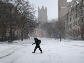 A woman walks through the campus of Yale University on January 4, 2018 in New Haven, Conneticut.
