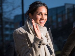 Meghan Markle waves to the crowd as she after a visit to Reprezent 107.3FM in Pop Brixton on January 9, 2018 in London, England. The Reprezent training programme was established in Peckham in 2008, in response to the alarming rise in knife crime, to help young people develop and socialize through radio.