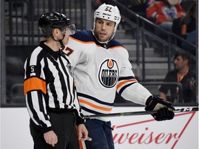 Referee Chris Rooney talks with Milan Lucic #27 of the Edmonton Oilers in the second period of the Oilers' game against the Vegas Golden Knights at T-Mobile Arena on January 13, 2018 in Las Vegas, Nevada. The Oilers won 3-2 in overtime.