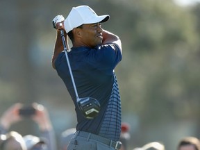 Tiger Woods plays his shot from the tenth tee during the second round of the Farmers Insurance Open at Torrey Pines North on January 26, 2018 in San Diego, California.