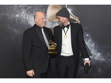 Chair of the Board for The Recording Academy John Poppo (L) and recording artist Dennis "Latroit" White pose backstage at the Premiere Ceremony during the 60th Annual Grammy Awards at Madison Square Garden on Jan. 28, 2018 in New York. (Nicholas Hunt/Getty Images for NARAS)
