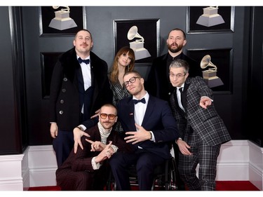 (Back, L-R) Recording artists Zachary Scott Carothers, Zoe Manville, Jason Wade Sechrist, (front L-R) John Gourley, Eric Howk, and Kyle O'Quin of  Portugal. The Man attend the 60th Annual Grammy Awards at Madison Square Garden on Jan. 28, 2018 in New York. (Jamie McCarthy/Getty Images)