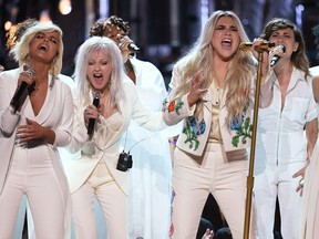 Recording artist Kesha (C) performs with (L-R) Bebe Rexha, Cyndi Lauper and Camila Cabello onstage during the 60th Annual GRAMMY Awards at Madison Square Garden on January 28, 2018 in New York City.
