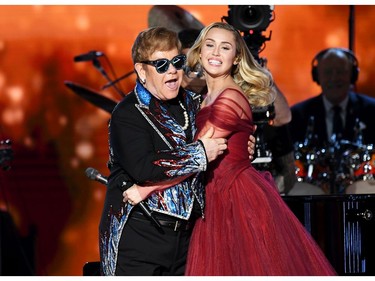 Elton John (L) and Miley Cyrus perform onstage during the 60th Annual Grammy Awards at Madison Square Garden on Jan. 28, 2018 in New York. (Kevin Winter/Getty Images for NARAS)