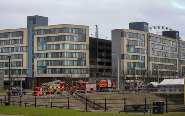 Emergency services attend the scene after a fire at a multi-storey car park on Liverpool's waterfront, north west England, Monday Jan. 1, 2018. (Peter Byrne/PA via AP)