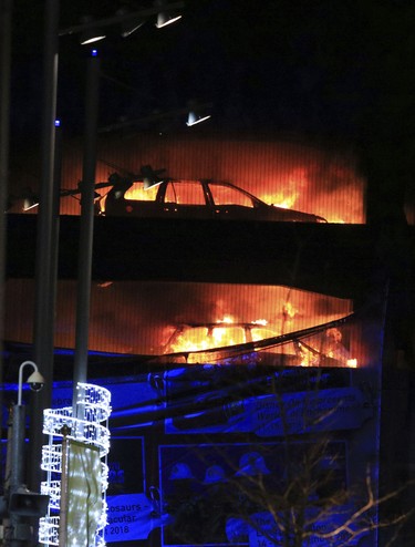 Emergency services attend the scene of a fire at a multi-storey car park on Liverpool's waterfront, north west England, Sunday Dec. 31, 2017. (Peter Byrne/PA via AP)