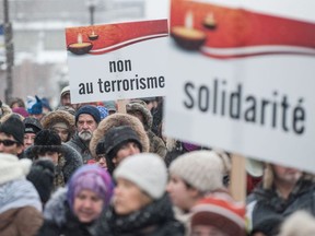 Several hundred people march in solidarity for the victims of the mosque shooting in Quebec City, on February 5, 2017.