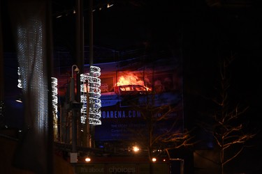 Cars burn during a blaze engulfing vehicles parked at a multi-storey parking garage near the Echo Arena, at the waterfront in Liverpool on Dec. 31, 2017. (PAUL ELLIS/AFP/Getty Images)