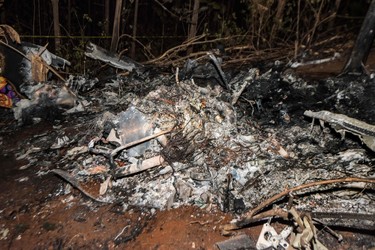 The remains of the burned fuselage of a small plane that crashed are seen in Guanacaste, Corozalito, Costa Rica on Dec. 31, 2017. (EZEQUIEL BECERRA/AFP/Getty Images)