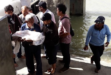 Rescuers evacuate victims after a ferry carrying some 45 people capsized in Tanjung Selor, North Kalimantan, on Jan. 1, 2018. (NURINDRA WIJAYA/AFP/Getty Images)