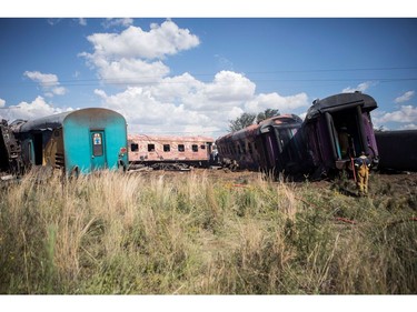 Emergency service workers work at the site where a train crashed into truck on January 4, 2018, in Kroonstad, Free State Province.