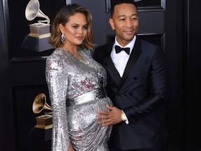 Chrissy Teigen (L) and John Legend arrive for the 60th Grammy Awards on January 28, 2018, in New York.