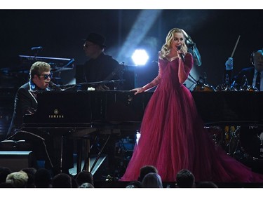 Elton John (L) and Miley Cyrus perform during the 60th Annual Grammy Awards show on Jan. 28, 2018, in New York. (TIMOTHY A. CLARY/AFP/Getty Images)