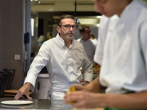 This file photo taken on September 21, 2017 shows French chef Sebastien Bras posing in the kitchen of his three-star restaurant Le Suquet, in Laguiole, southern France, after announcing that he asked not to be included in the Michelin Guide starting in 2018. Sebastien Bras, chef of the three-star restaurant Le Suquet, announced on September 20, 2017, he asked not to be included in the Michelin Guide starting in 2018, to ease off on such a pressure. The upcoming 2018 Michelin guide will be umveiled on February 5, 2018.
