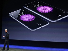 In this March 9, 2015 file photo, Apple CEO Tim Cook talks about the iPhone 6 and iPhone 6 Plus during an Apple event in San Francisco. U.S. authorities are investigating Apple's slowing of older iPhones, according to published reports. The Wall Street Journal and Bloomberg reported Tuesday, Jan. 30, 2018, that the Department of Justice and the Securities and Exchange Commission are probing whether Apple violated securities laws.